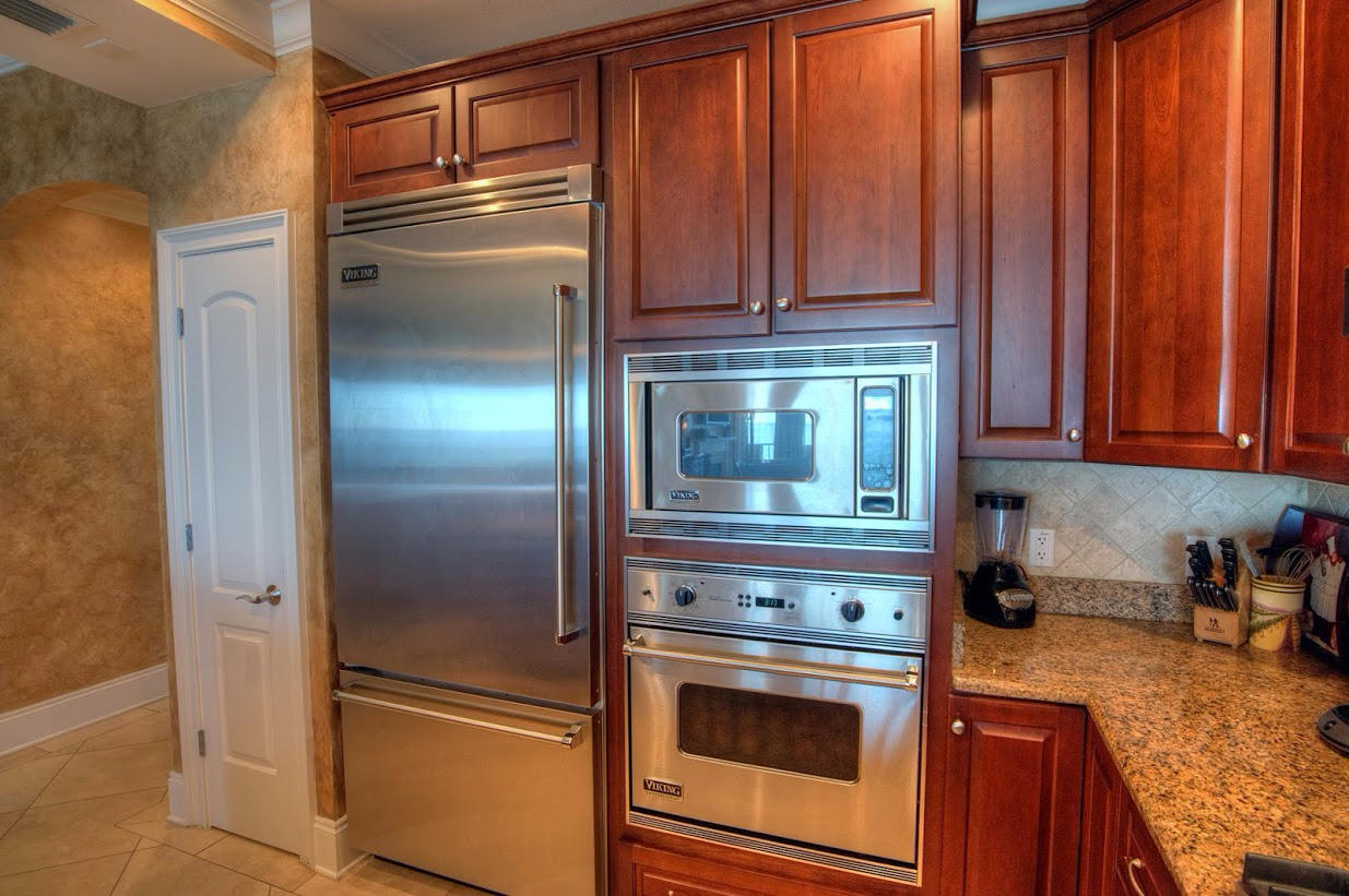 2421 West County Highway 30A, Unit C201 Santa Rosa Beach, FL 32459 - Photo 14 of 50 a kitchen with appliances and a refrigerator