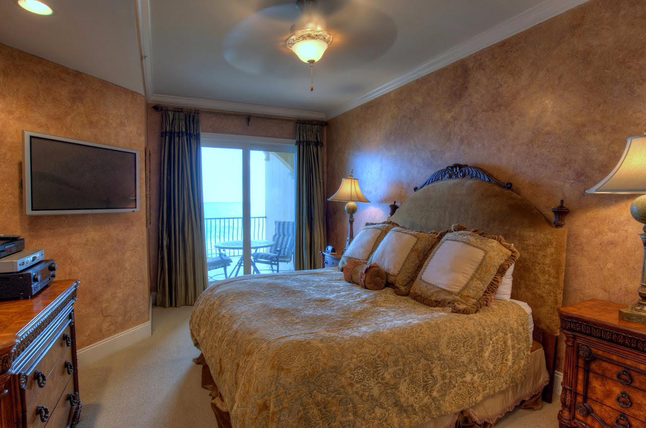 2421 West County Highway 30A, Unit C201 Santa Rosa Beach, FL 32459 - Photo 17 of 50 a bedroom with a bed and a flat tv screen on dresser
