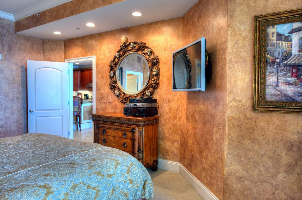 2421 West County Highway 30A, Unit C201 Santa Rosa Beach, FL 32459 - Photo 18 of 50 a bedroom with a bed and a mirror