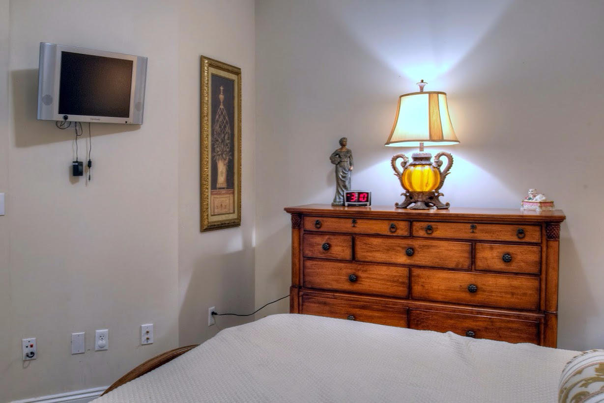 2421 West County Highway 30A, Unit C201 Santa Rosa Beach, FL 32459 - Photo 26 of 50 a view of room with a flat screen tv and lamp on table
