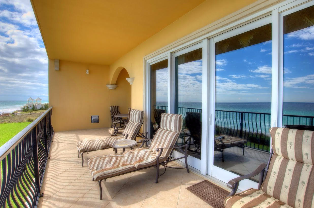 2421 West County Highway 30A, Unit C201 Santa Rosa Beach, FL 32459 - Photo 31 of 50 a balcony with furniture and a potted plant
