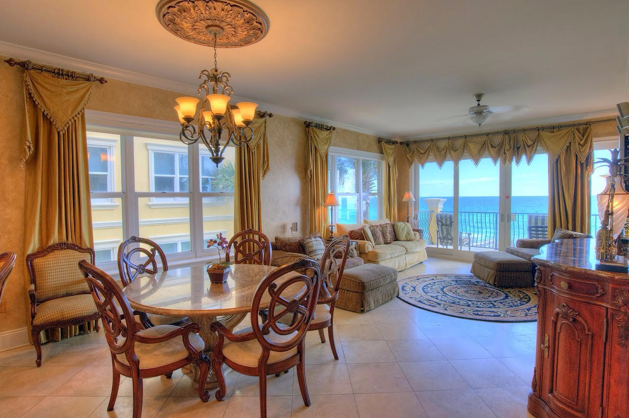 2421 West County Highway 30A, Unit C201 Santa Rosa Beach, FL 32459 - Photo 6 of 50 a living room with fireplace furniture and a chandelier