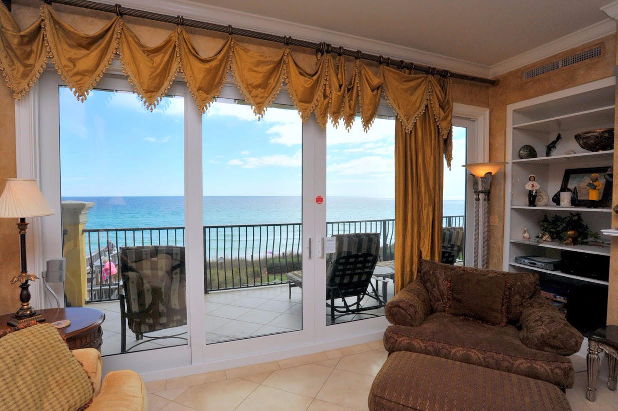 2421 West County Highway 30A, Unit C201 Santa Rosa Beach, FL 32459 - Photo 9 of 50 a living room with furniture and a floor to ceiling window