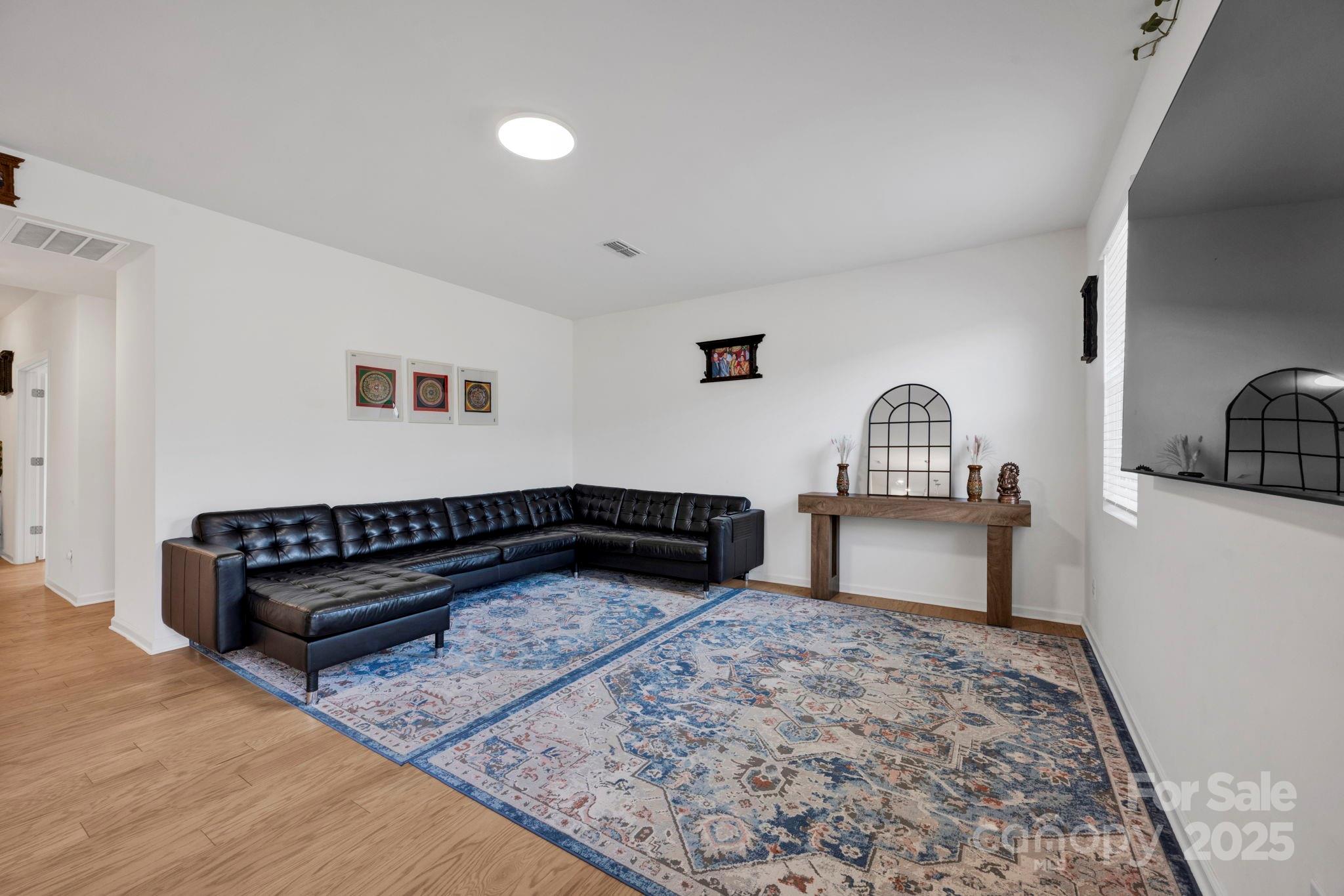 2712 Trinity Street Monroe, NC 28110 - Photo 15 of 48 a living room with a couch