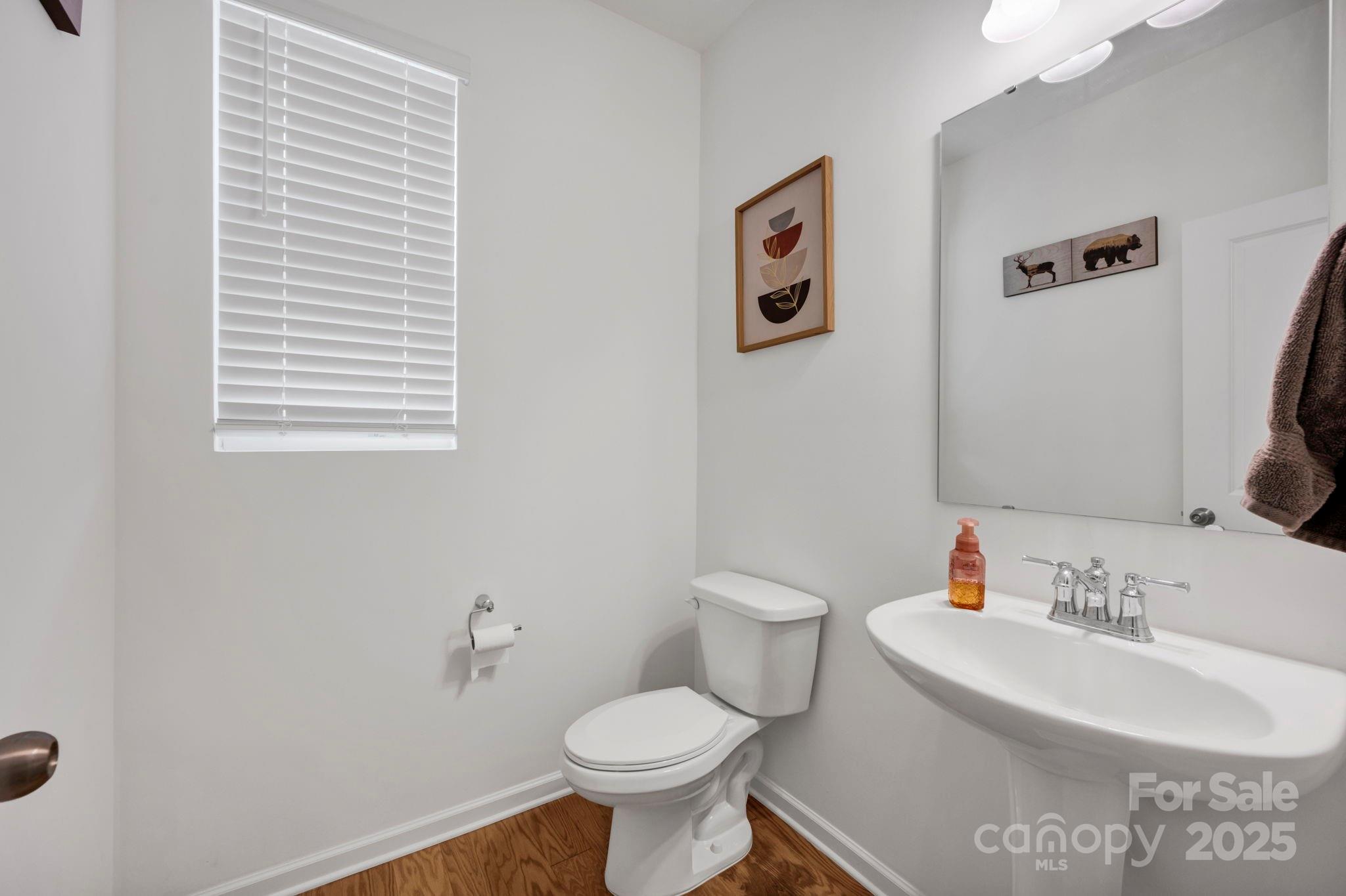 2712 Trinity Street Monroe, NC 28110 - Photo 19 of 48 a bathroom with a sink toilet and a mirror