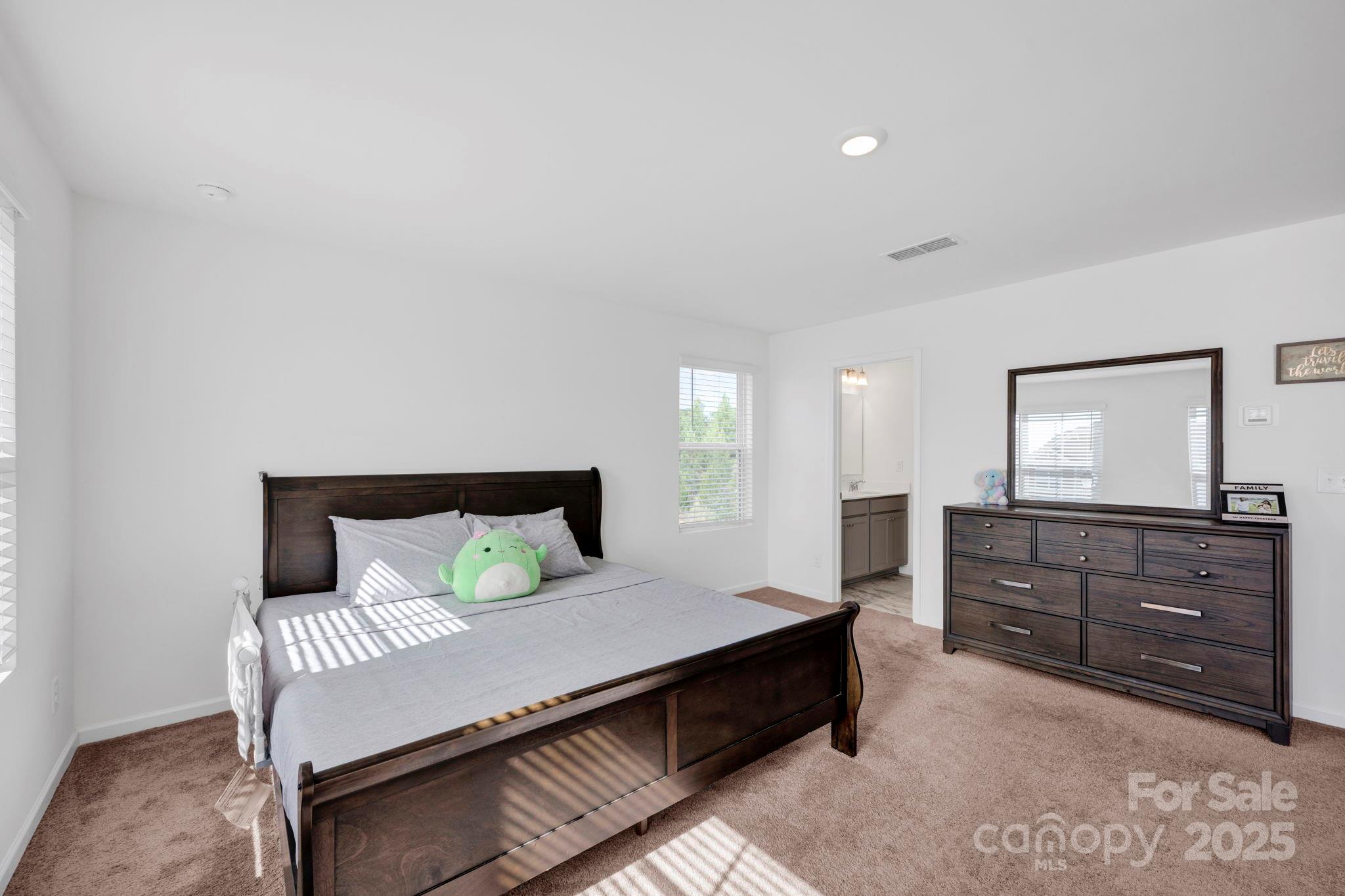 2712 Trinity Street Monroe, NC 28110 - Photo 24 of 48 a bedroom with a bed and a dresser