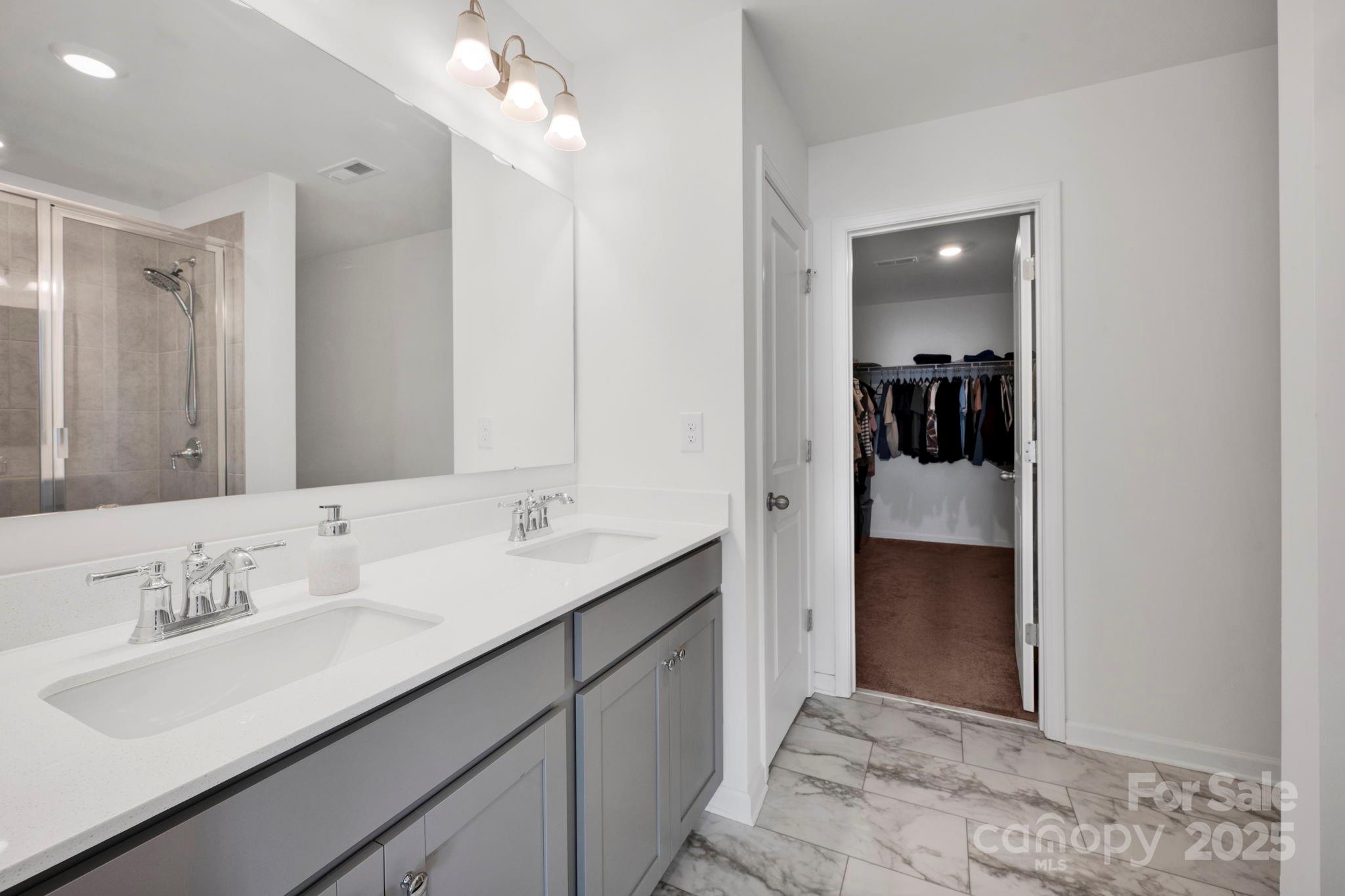 2712 Trinity Street Monroe, NC 28110 - Photo 26 of 48 a en suite bathroom with a sink double vanity and mirror
