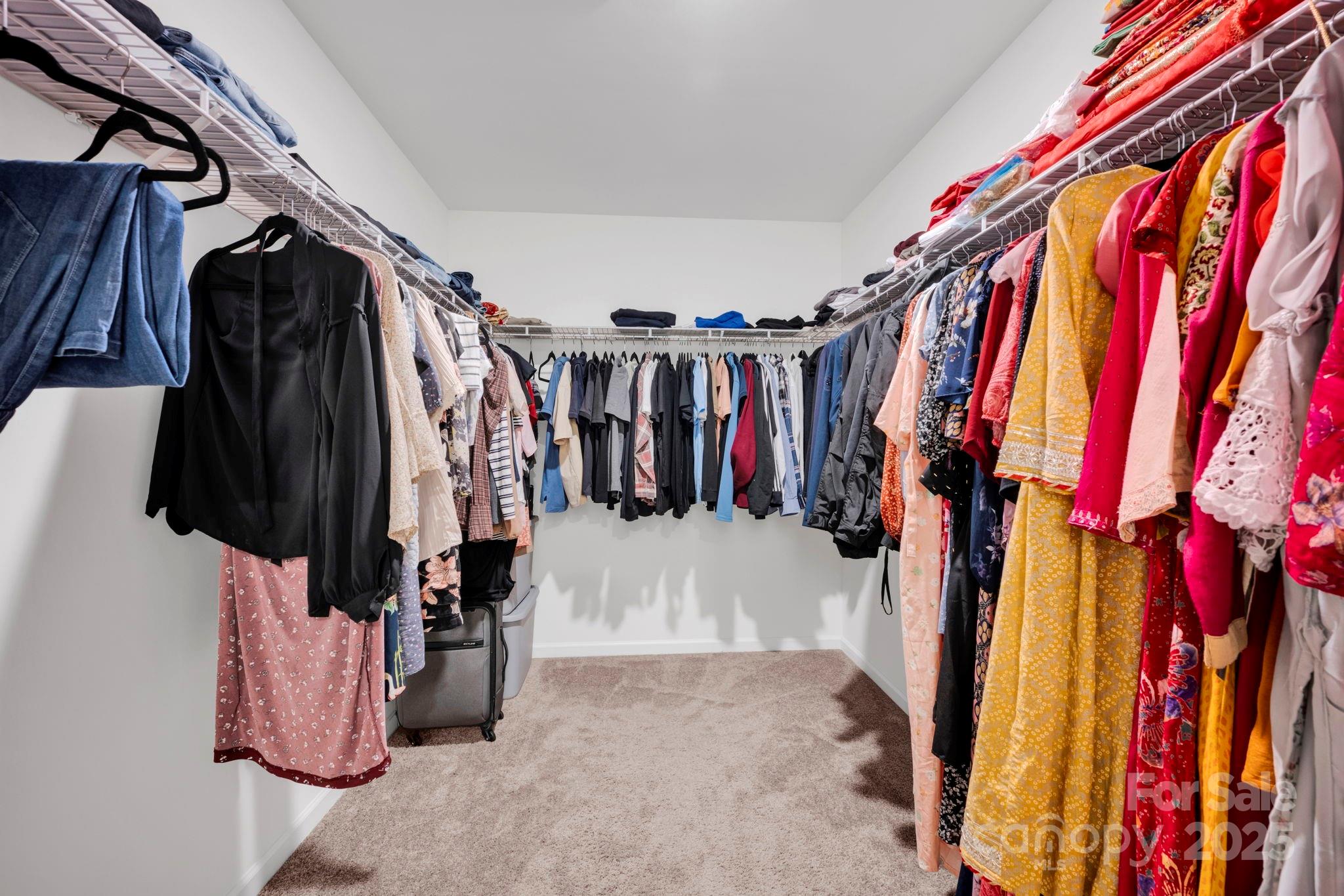 2712 Trinity Street Monroe, NC 28110 - Photo 27 of 48 a view of walk in closet with clothes and shoes
