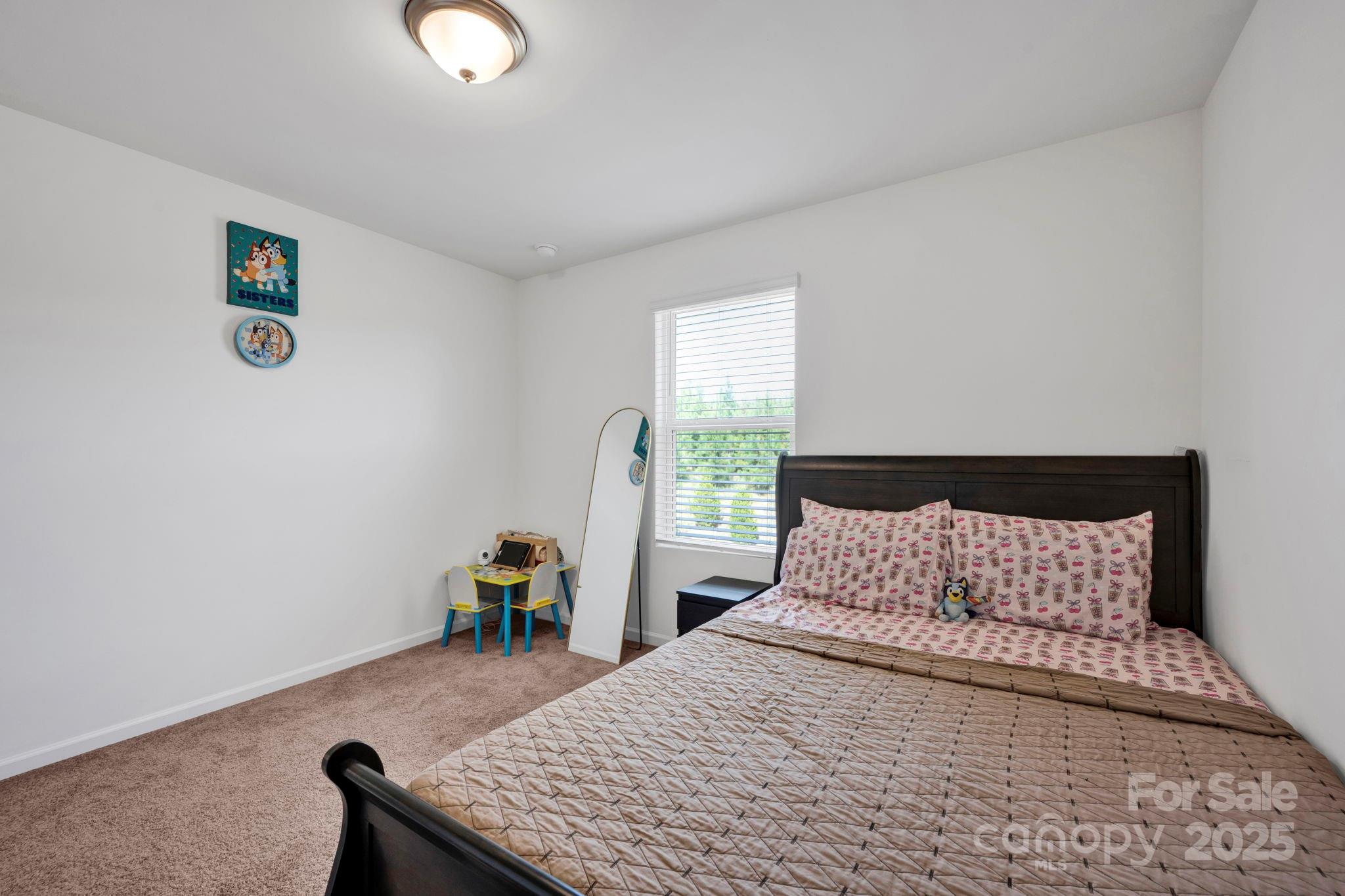 2712 Trinity Street Monroe, NC 28110 - Photo 35 of 48 a bedroom with a bed and window