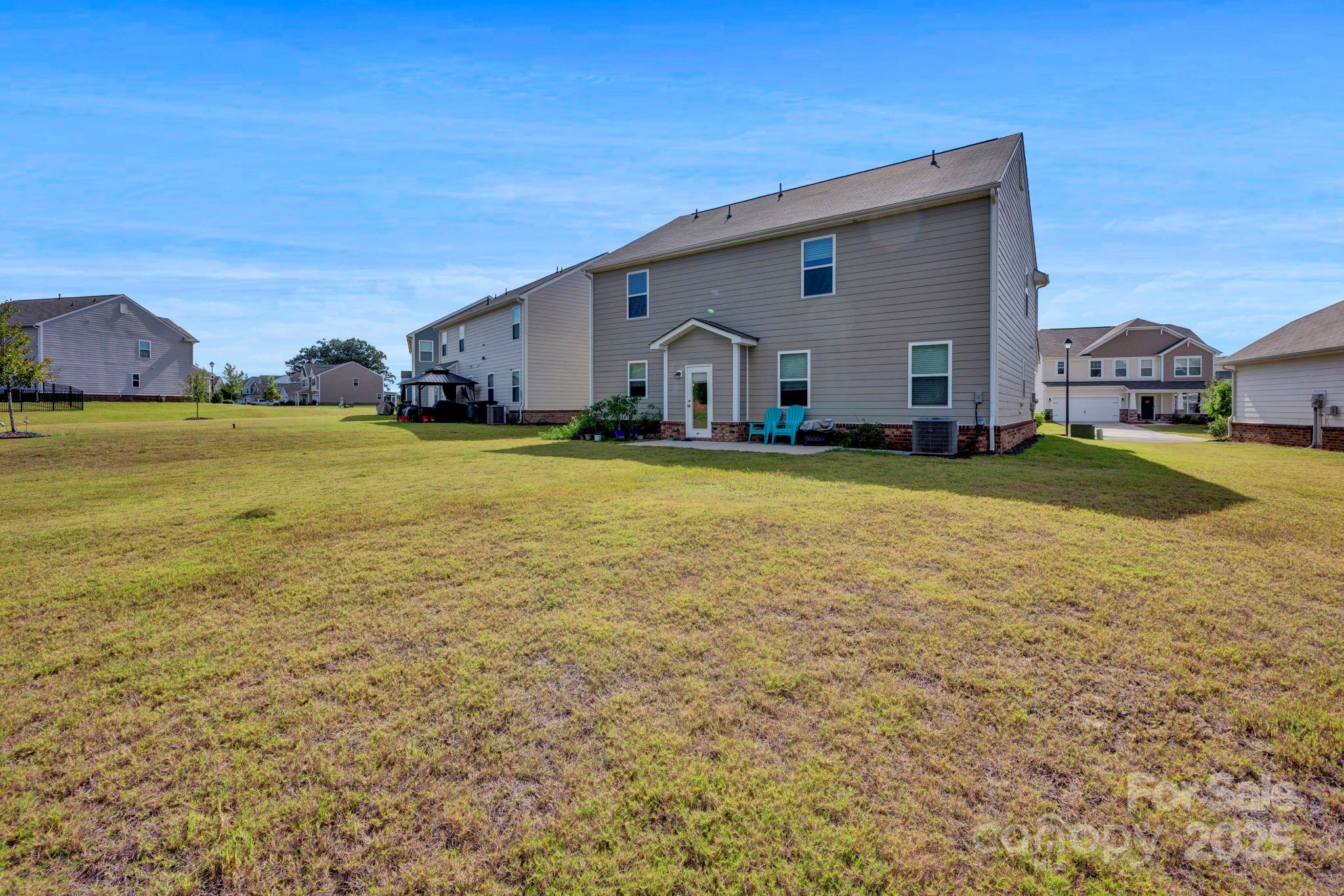 2712 Trinity Street Monroe, NC 28110 - Photo 40 of 48 a view of a house with a big yard and a large tree