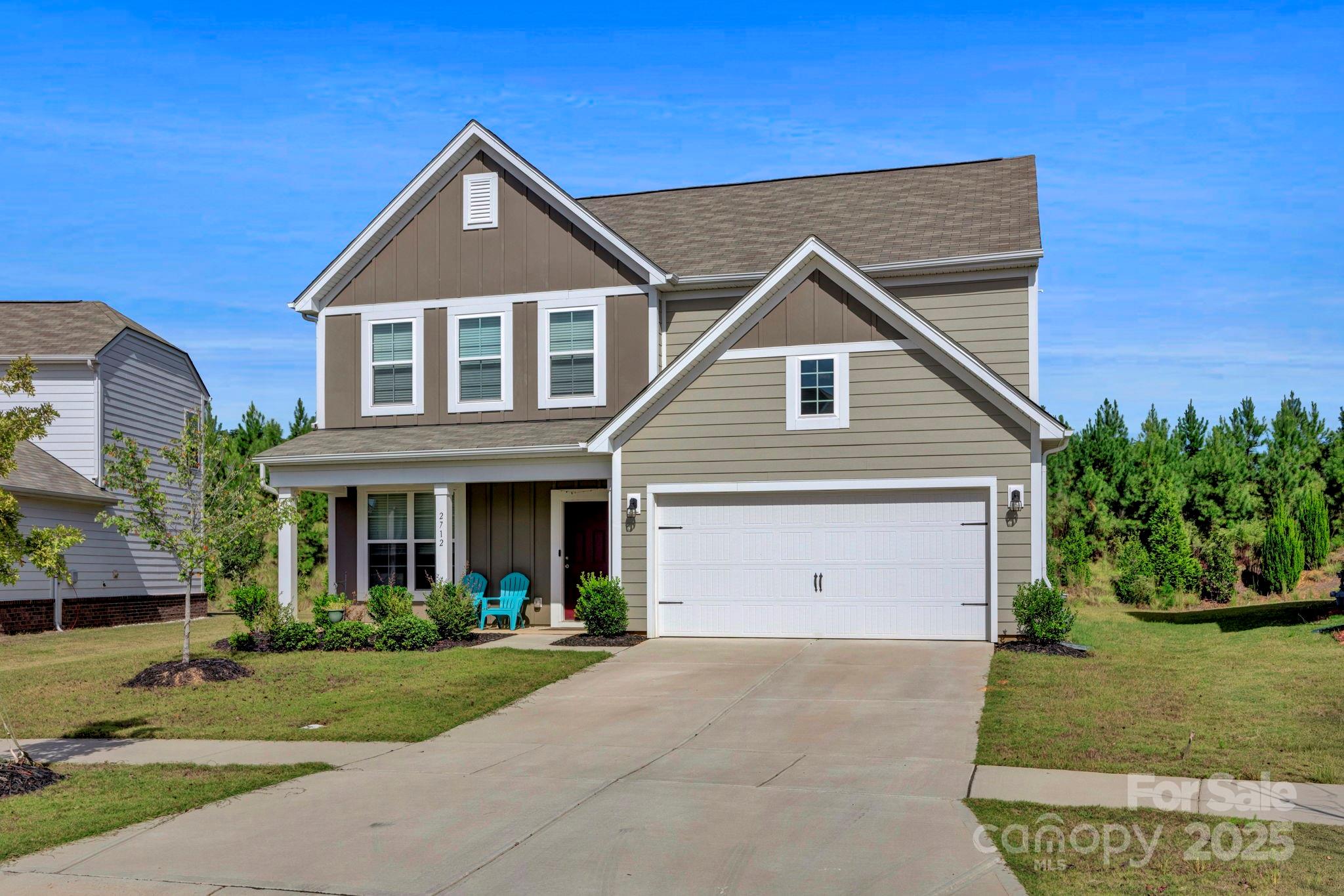 2712 Trinity Street Monroe, NC 28110 - Photo 4 of 48 a front view of a house with a yard and garage