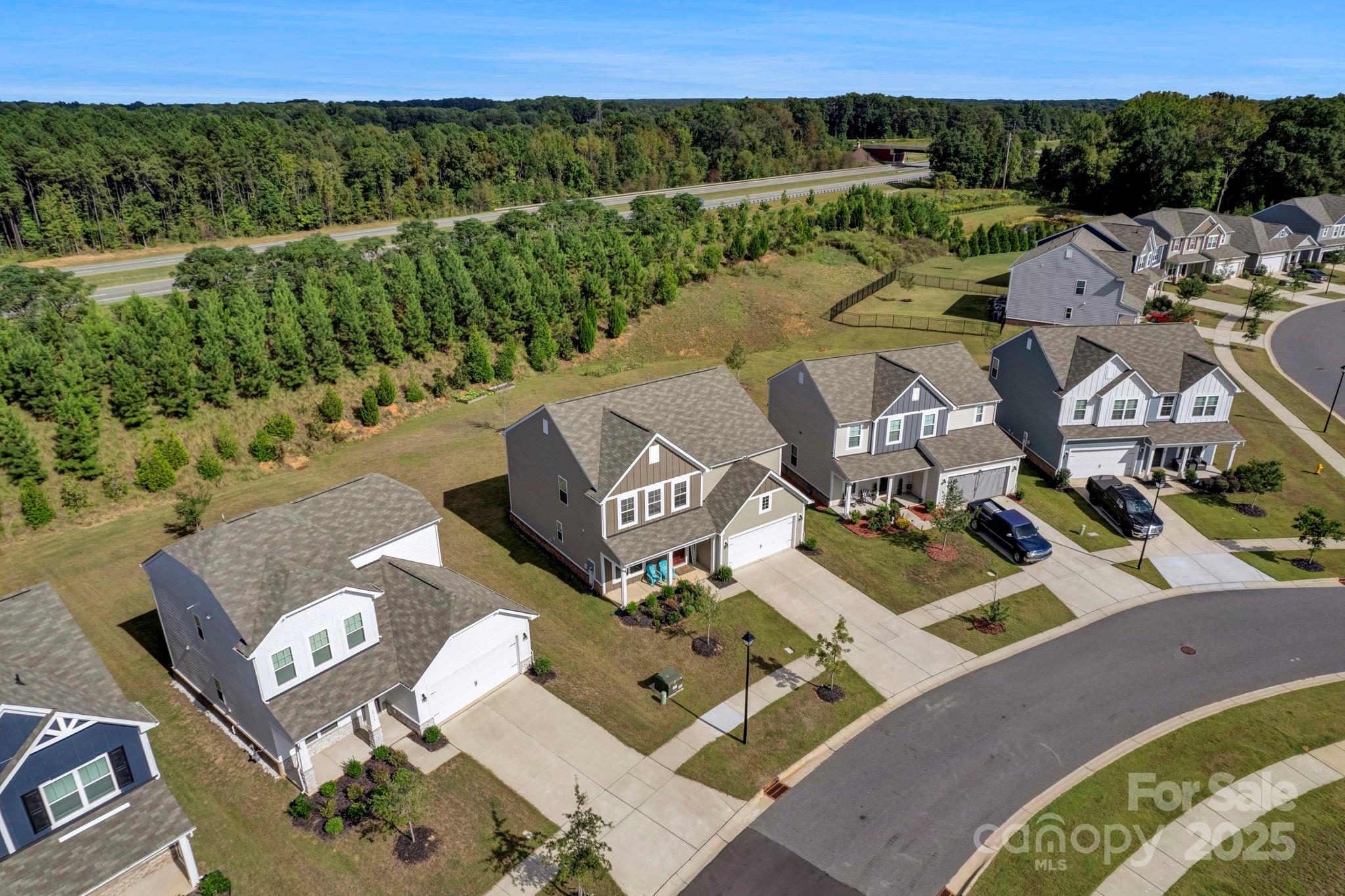 2712 Trinity Street Monroe, NC 28110 - Photo 48 of 48 an aerial view of a house with a lake view