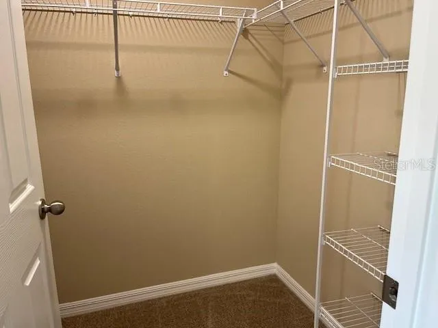 a view of a room with racks on the wall