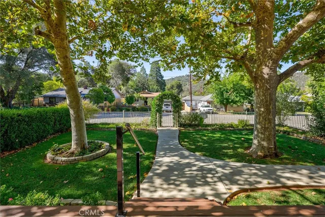 a view of a yard with a house and a garden