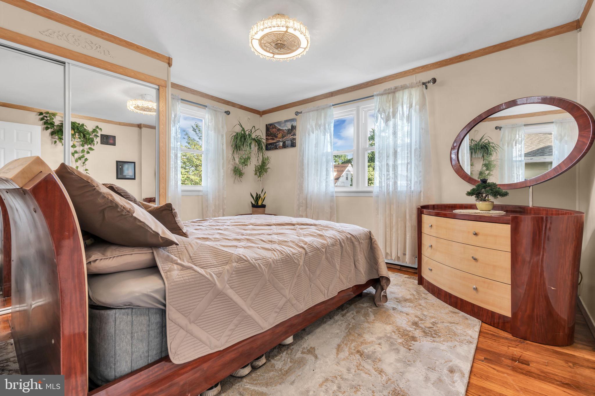 80 Locust Avenue Hamilton, NJ 08620 - Photo 15 of 24 a bedroom with a bed and a dresser