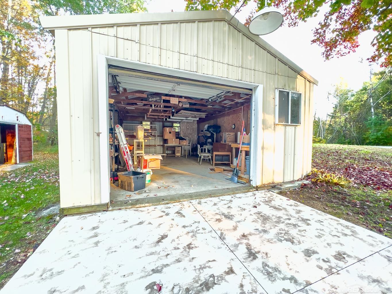 1123 Radov Road Gladwin, MI 48624 - Photo 23 of 29 One and a half car garage.