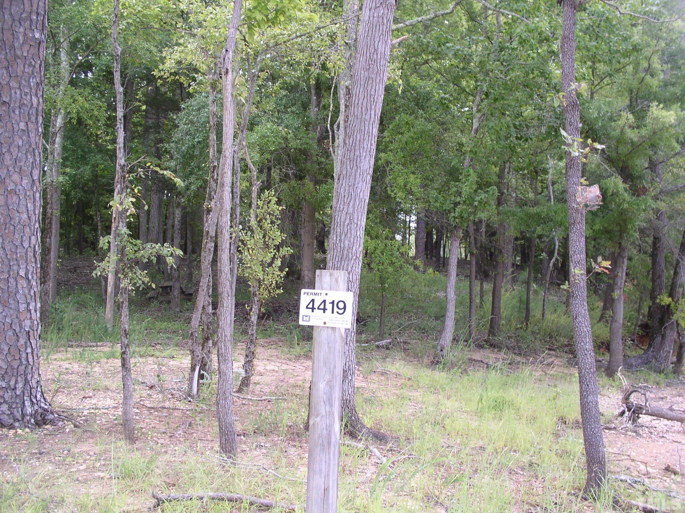 198 B South Harrison Lane Henderson, NC 27537 - Photo 5 of 14 a backyard of a house with lots of green space