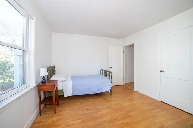 a bedroom with furniture and a window