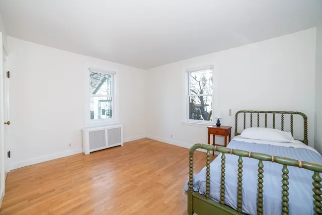 a bathroom with a granite countertop sink and a window