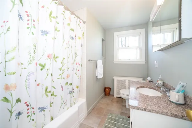 a bedroom with a bed and dresser