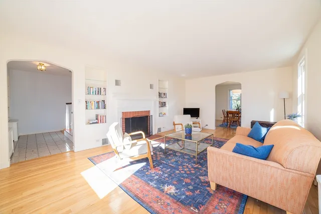 a living room with furniture and a rug