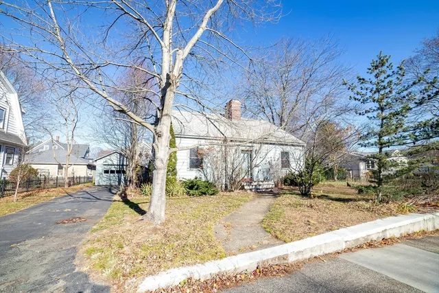 a view of a yard with snow on the road