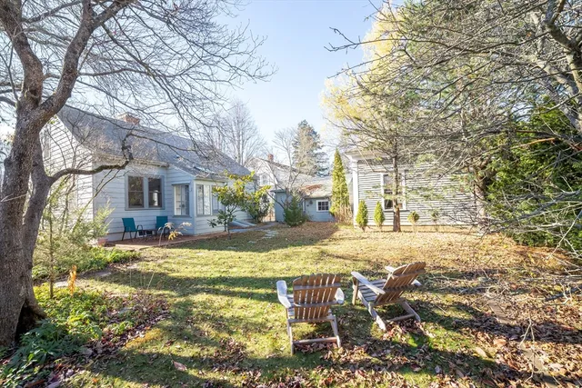 a view of yard with swimming pool and sitting area
