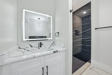 a bathroom with a sink and a mirror
