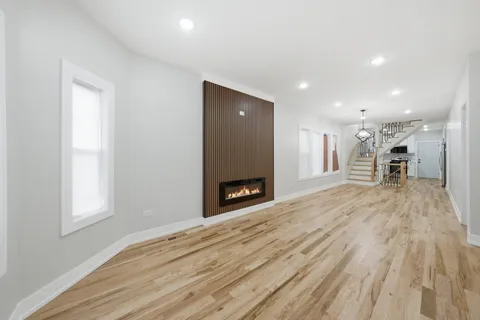 a view of a room with a fireplace and a window