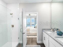 4519 Trinity Way, Unit THC1 Kissimmee, FL 34746 - Photo 11 of 14 a bathroom with a granite countertop sink and a mirror