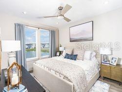 4519 Trinity Way, Unit THC1 Kissimmee, FL 34746 - Photo 12 of 14 a bedroom with a large bed and a window