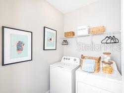 4519 Trinity Way, Unit THC1 Kissimmee, FL 34746 - Photo 13 of 14 a bedroom with a bed and a cabinets