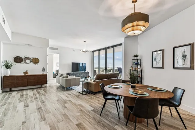 a kitchen with stainless steel appliances white cabinets and a refrigerator