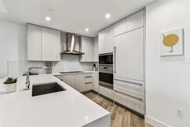 a bedroom with a bed and a flat tv screen on a dresser