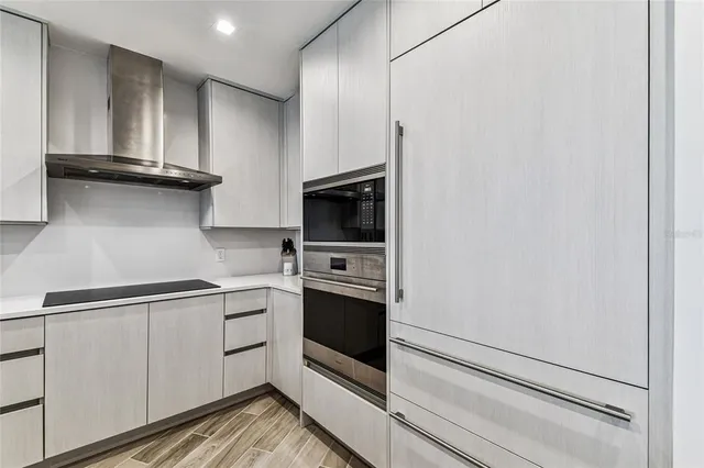 a bedroom with a large bed and a large window