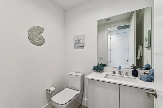 a bedroom with a large window and a flat screen tv