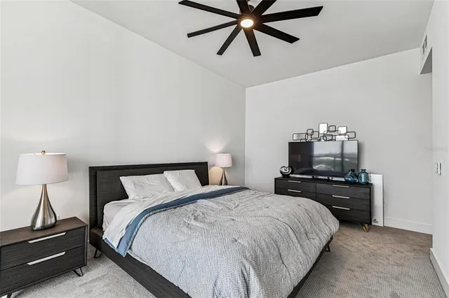 a view of an house with swimming pool and chairs