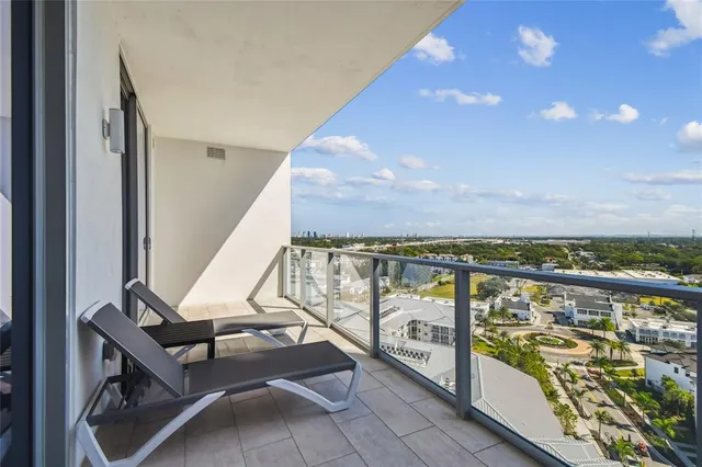 a kitchen with stainless steel appliances kitchen island granite countertop a table and chairs