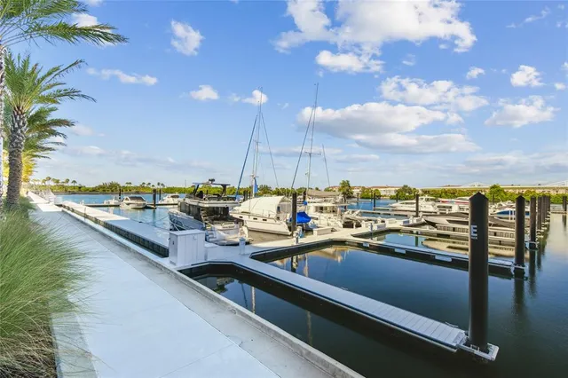 a living room with furniture and floor to ceiling window