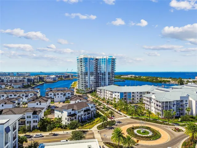a kitchen with stainless steel appliances a sink and a refrigerator