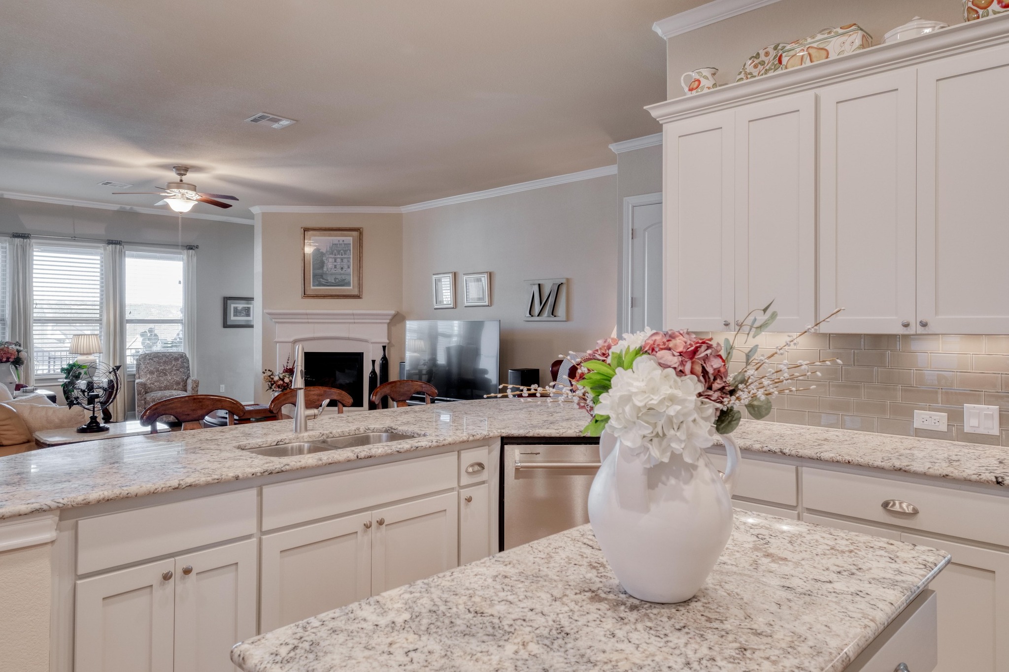 3204 Venezia View Leander, TX 78641 - Photo 7 of 28 Kitchen with decorative molding open to living