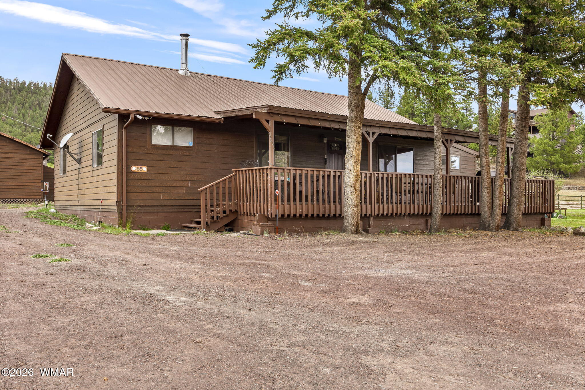 85 Main Street Greer, AZ 85927 - Photo 6 of 55 a front view of a house with a garage