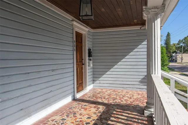a view of a balcony with white door