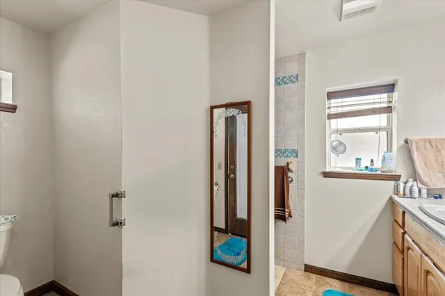 a bathroom with a tub and shower view