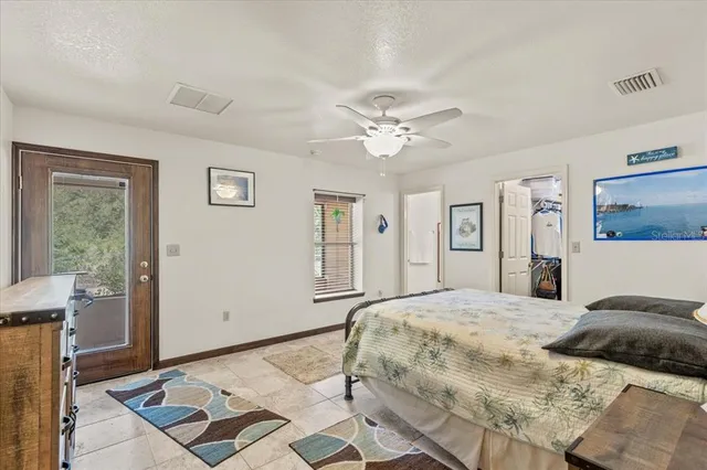 a bedroom with a large bed and a window