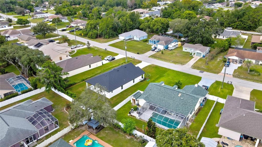 6589 Freeport Drive Spring Hill, FL 34608 - Photo 58 of 63 an aerial view of residential house with outdoor space and swimming pool