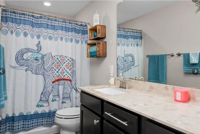 a bedroom with a bed and a desk