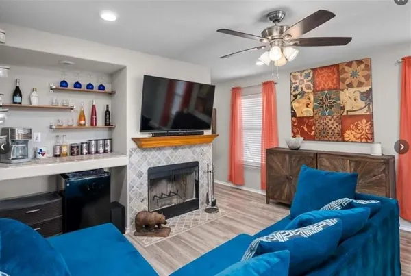 a view of living room filled with furniture and wooden floor