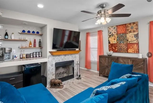 a view of living room filled with furniture and wooden floor