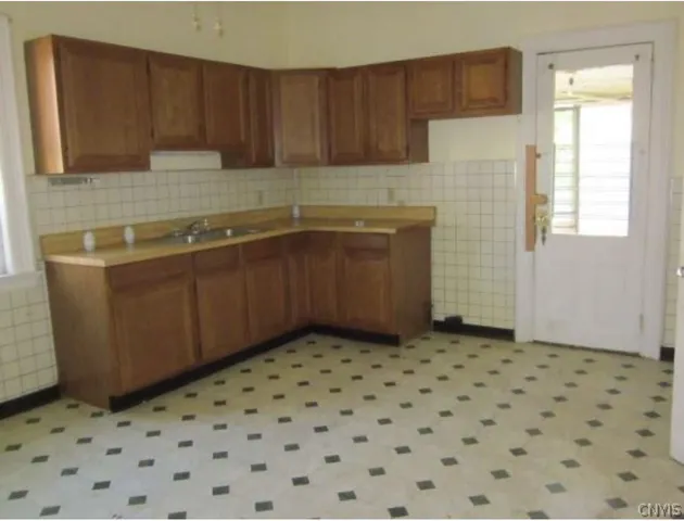 a kitchen with a cabinets and a sink
